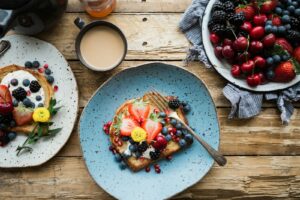 A generic breakfast table with toast, fruit and coffee; not a meal at a named Tokyo hotel.
